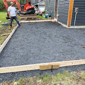 Compacted gravel base framed for a new slab